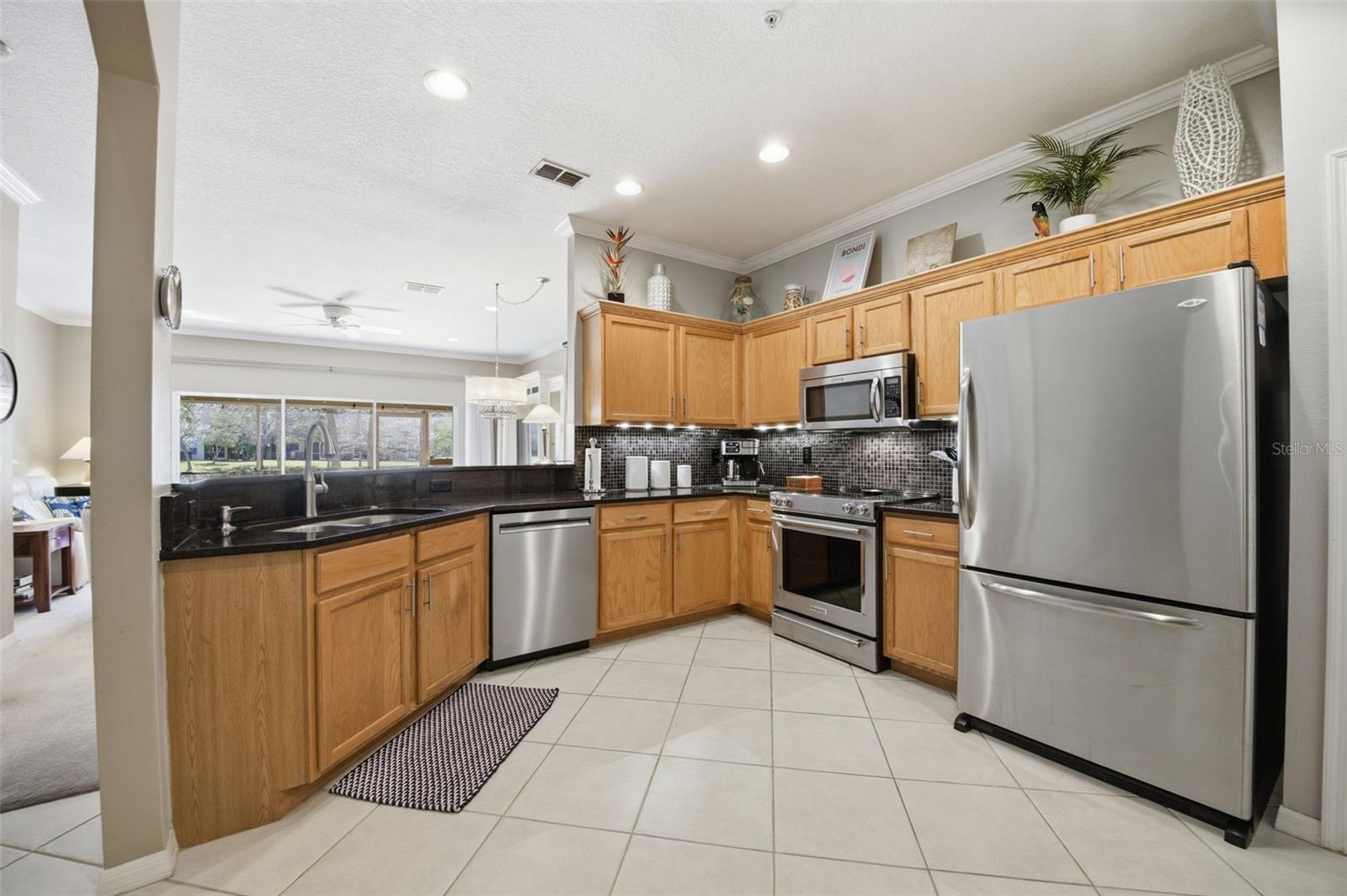 11125 KAPOK GRAND CIR, MADEIRA BEACH, FL — photo 11