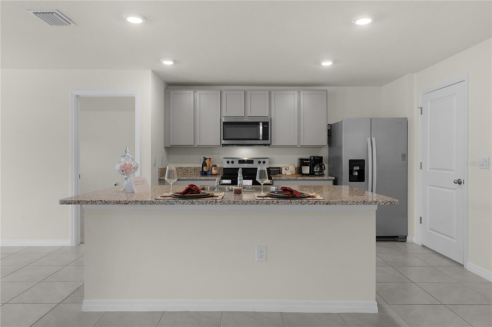 8661 TRIUMPH CIR, WILDWOOD, FL — photo 9