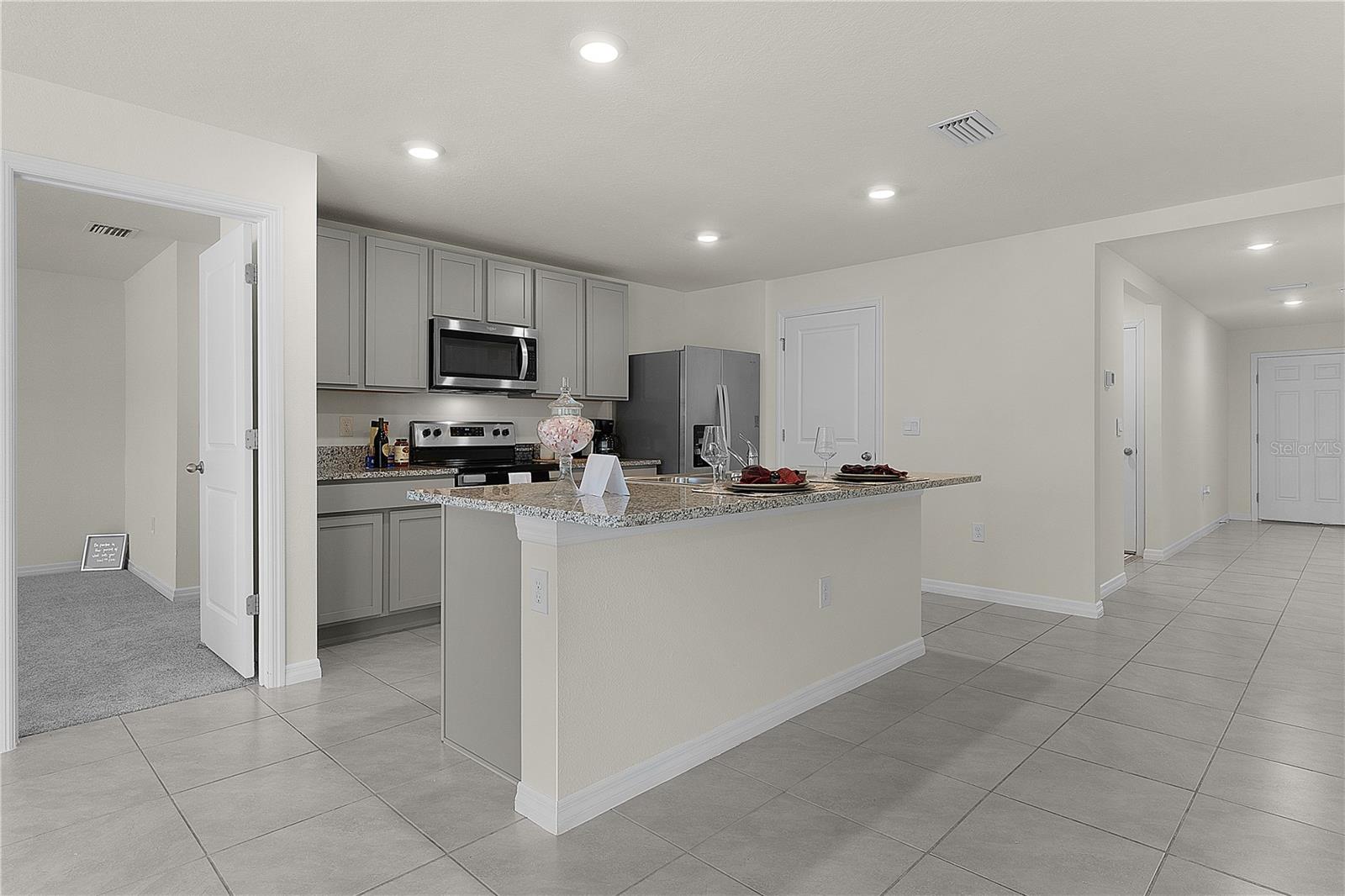 8661 TRIUMPH CIR, WILDWOOD, FL — photo 10
