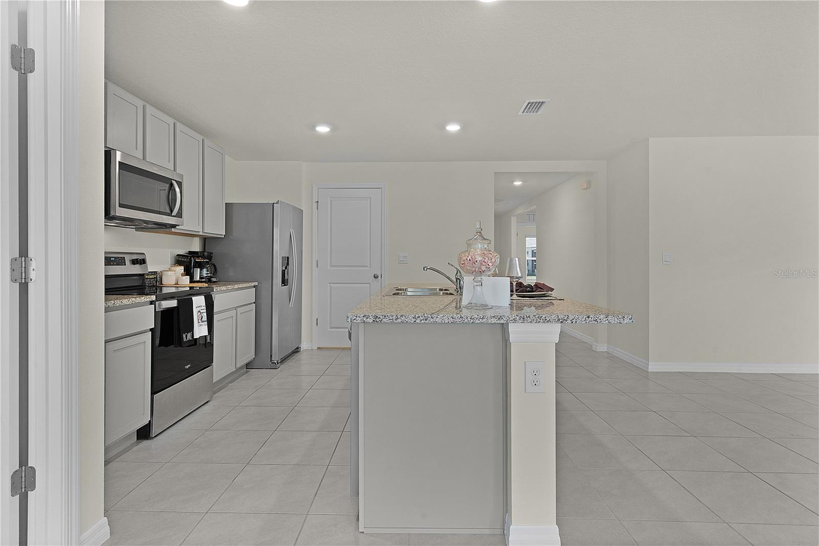 8661 TRIUMPH CIR, WILDWOOD, FL — photo 11