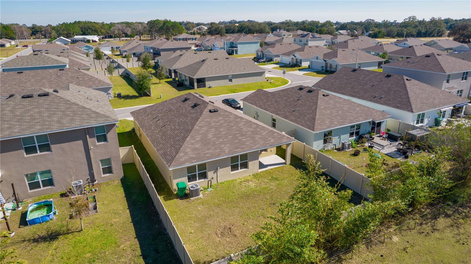 8661 TRIUMPH CIR, WILDWOOD, FL — photo 40