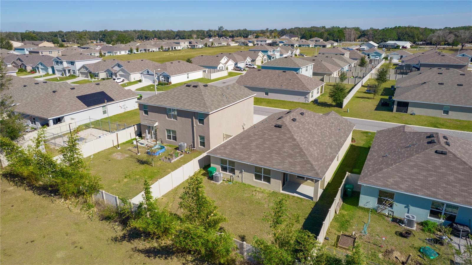 8661 TRIUMPH CIR, WILDWOOD, FL — photo 41
