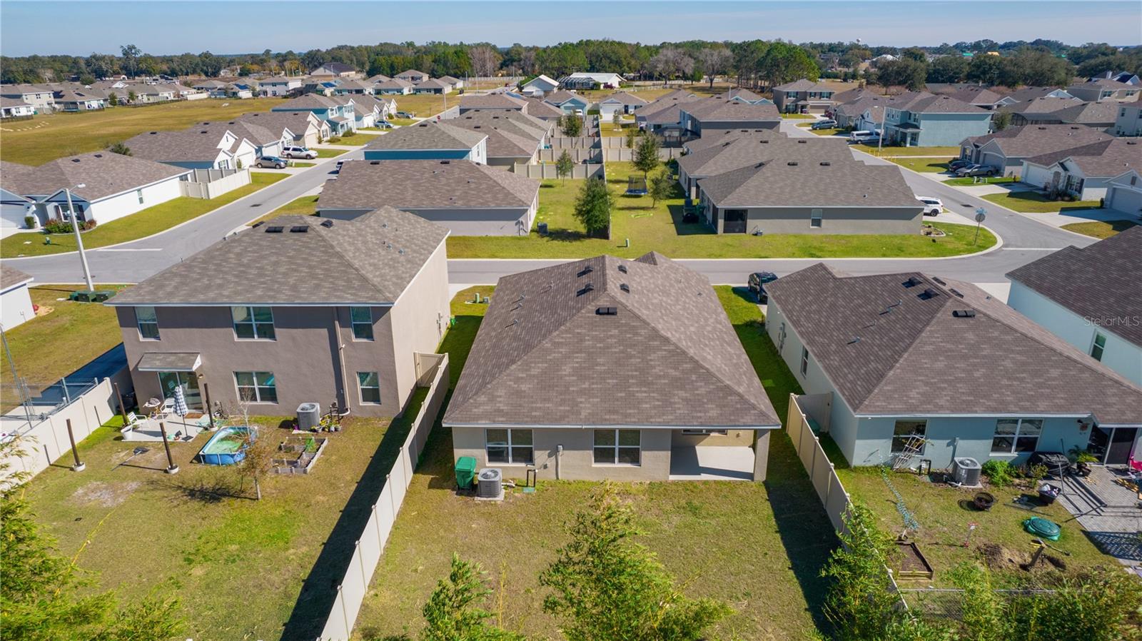 8661 TRIUMPH CIR, WILDWOOD, FL — photo 42
